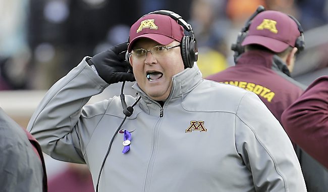 Minnesota acting head coach Tracy Claeys calls out to players during the fourth quarter against Nebraska in Minneapolis Saturday, Oct. 26, 2013. (AP Photo/Ann Heisenfelt)