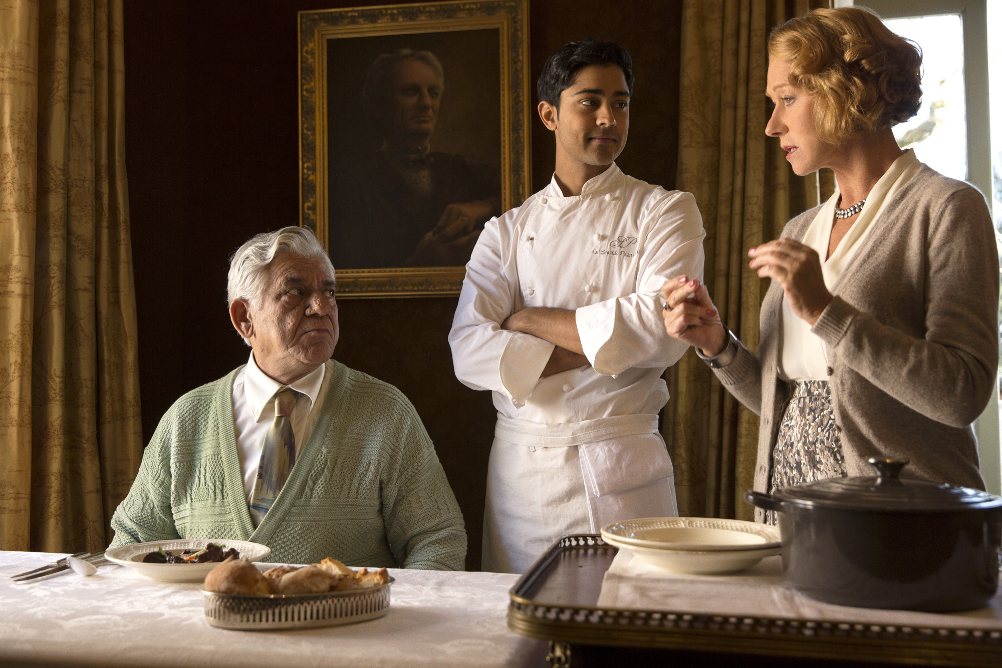 This image released by DreamWorks II shows, from left, Om Puri, Manish Dayal and Helen Mirren in a scene from The Hundred-Foot Journey. (AP Photo/François Duhamel, DreamWorks II)